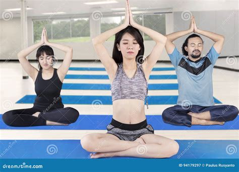 Female Instructor Practicing Yoga With Her Clients Stock Image Image