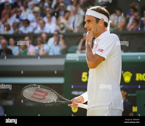 Side View Of Thoughtful Swiss Tennis Player Roger Federer Standing In