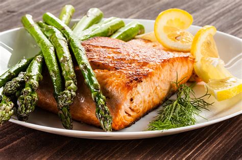 Grilled Salmon With French Fries And Asparagus Stock Photo