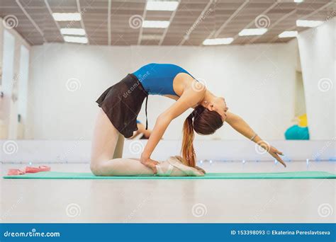 the girl is engaged in gymnastics doing stretching in the gym stock image image of people