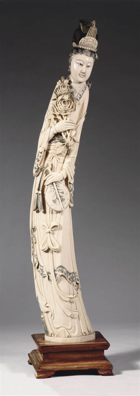 A Chinese Ivory Carving Of A Standing Lady