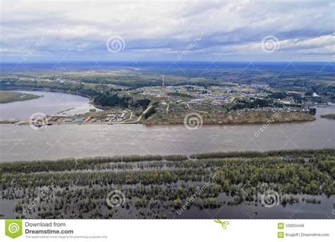 Siberian Village On The Banks Of The River In Spring Flood Stock Photo