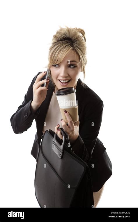 Business Woman On The Phone Spilling Her Drink On Her Way To Work Stock