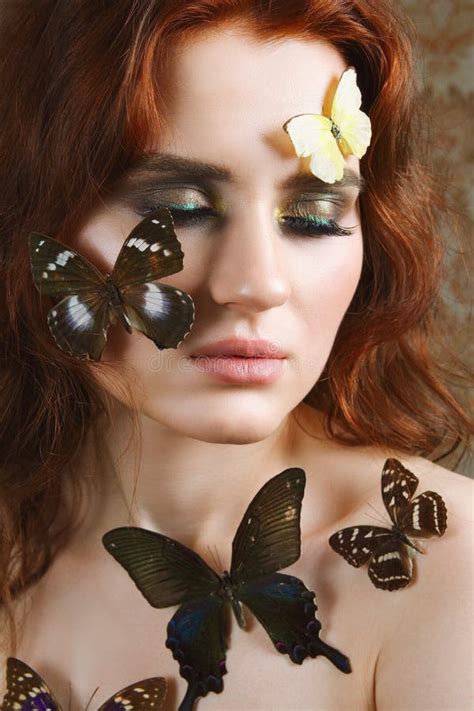Portrait Of Tender Girl With Butterflies On Her Face And Body Stock