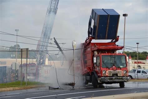 Power Outages Reported After Trash Truck Hits Utility Pole Catches On
