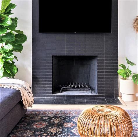 brick subway tiles surrounding fireplace | Fireplace tile, Fireplace