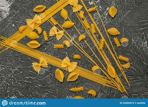 Top View Various Types Of Italian Pasta On Wooden Background Stock