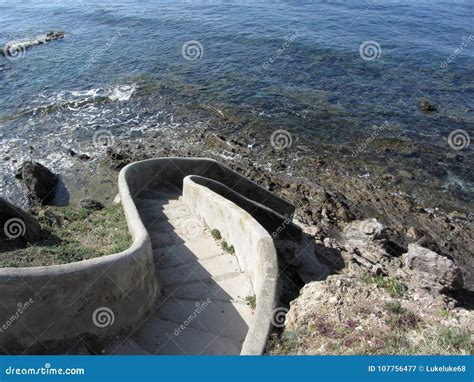 Concrete Staircase Down To The Sea Spiral Stairs Descent To The Water