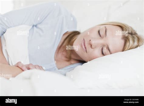 Close Up Of Woman Asleep In Bed Stock Photo Alamy