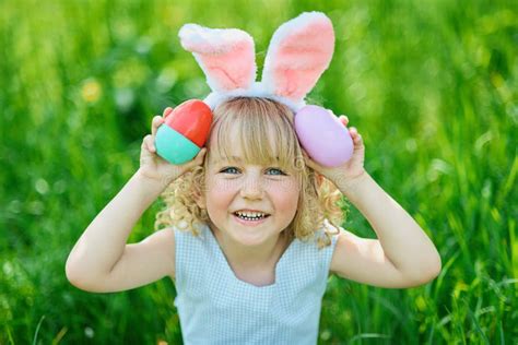 Cute Funny Girl With Easter Eggs And Bunny Ears At Garden Easter Concept Stock Image Image Of