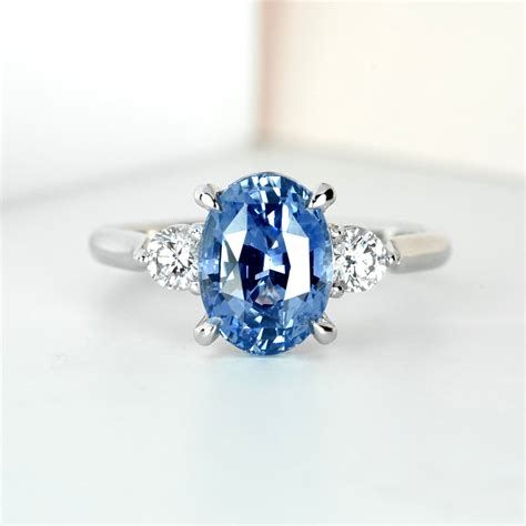 Vivid Medium Blue Oval Sapphire Diamond Platinum Trilogy Engagement Ri