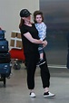 Anne Hathaway Out with Her Son Jonathan Arrives at JFK Airport in New ...