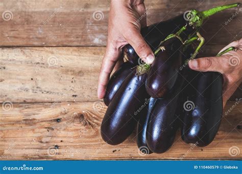 Hands Take Few Eggplants On Wooden Boards Stock Image Image Of