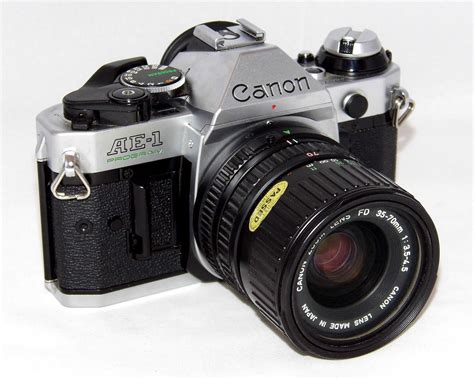 The camera has the following features: Canon AE-1 Program | Best film cameras, Film cameras ...