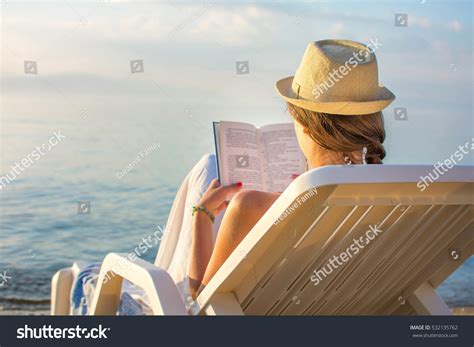 Girl Reading Book Sunbed Beach Stock Photo Shutterstock