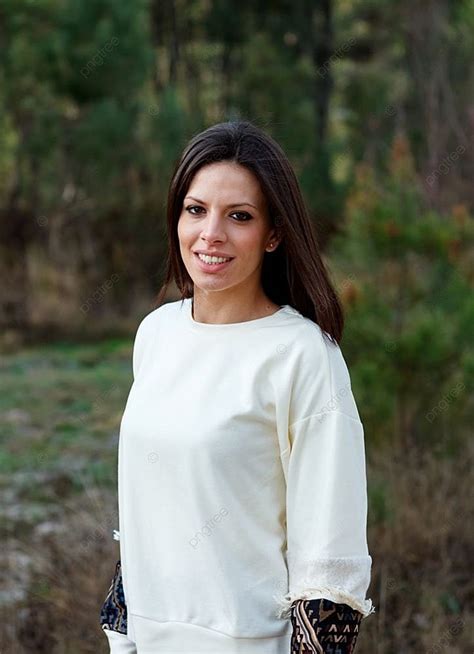 Attractive Brunette Girl Enjoying A Day In The Countryside Background