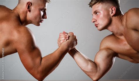 Two Men Arm Wrestling Rivalry Closeup Of Male Arm Wrestling Two