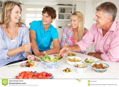 Family Enjoying Meal at Home Stock Image - Image of female, food: 21041947