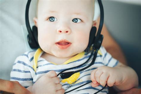 Infant Baby Child Boy Six Months Old With Headphones Stock Photo