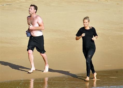 Lara Bingle Flaunts Her Cleavage In A Black Bikini As She Soaks Up The