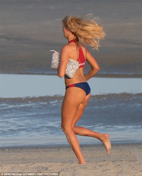 Kelly Rohrbach Showcases Her Pert Derriere In Baywatch Bikini On Set
