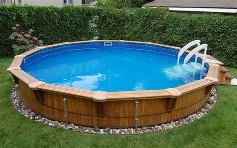 Not only will you never again have to climb a pool ladder, but a deck will also create a. Aqua-Wood | Round semi in ground wood pool | Above ground ...