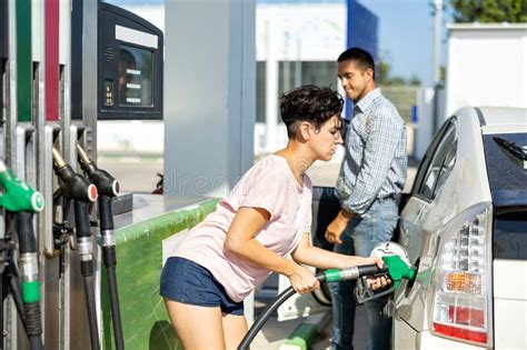 Latin Woman Filling Up Tank Of Her Car With Gasoline In Gas Station Stock Image Image Of Auto