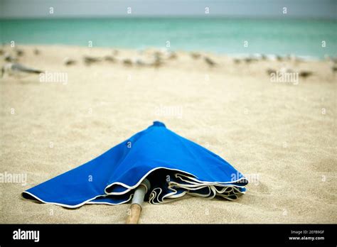 Close Up Of A Folded Beach Umbrella On The Beach Stock Photo Alamy