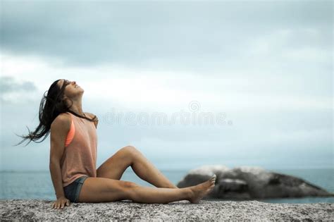 Woman Flicking Her Hair On A Rock At Sunset On Bakovern Beach Cape Town Stock Image Image Of