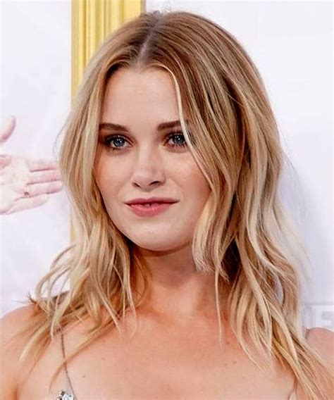 Virginia Gardner Long Wavy Blonde Hairstyle With Layered Bangs And Light Blonde Highlights
