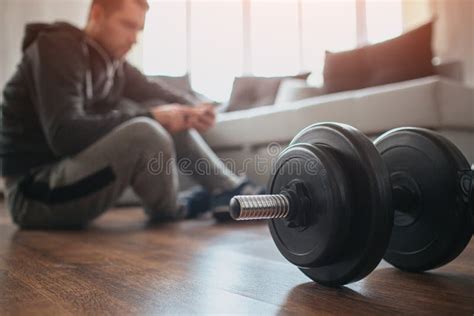 Young Ordinary Man Go In For Sport At Home Cut View With Blurred Background Where Workout