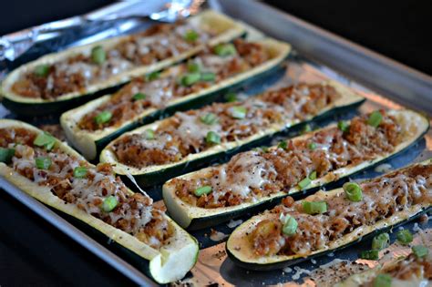 Packed with a flavorful taco filling and topped with melted cheese, you won't miss the tortilla! STUFFED ZUCCHINI BOATS - Hugs and Cookies XOXO