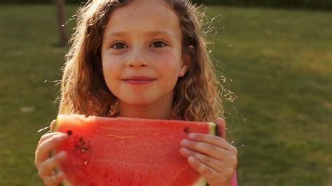 One Child Eating Water Melon In Park Stock Video Footage 0007 Sbv