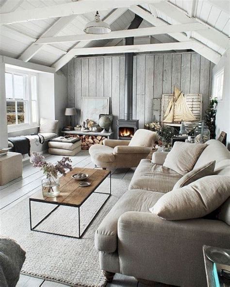 A Living Room Filled With Furniture And A Fire Place In The Middle Of