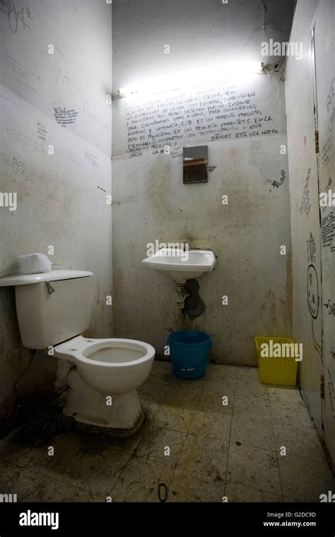 Dirty Bathroom With Writing On Walls Stock Photo Alamy