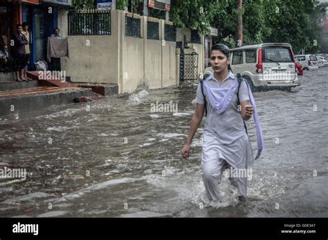 School Girl Crosses The Flooded Street As It Rains Heavily In Jaipur