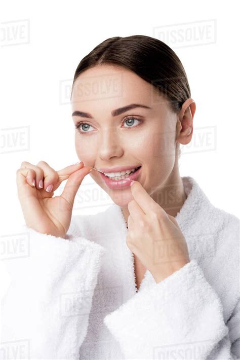 Beautiful Woman In White Bathrobe Flossing Teeth Isolated On White