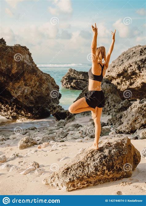 Sporty Woman Practice Yoga At Ocean Coast With Sunset Stock Photo Image Of Evening Body