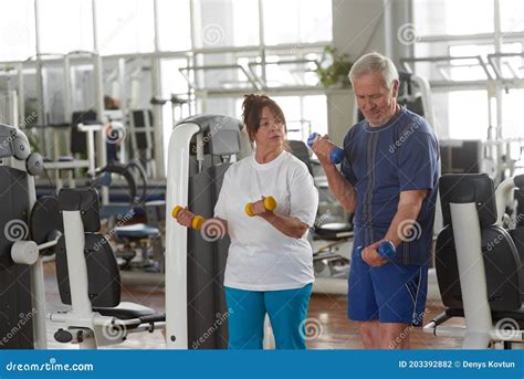 Elderly Couple Exercising At Gym Stock Photo Image Of Couple