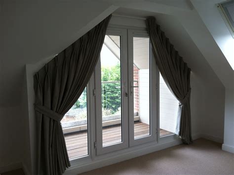 Solar shades provide excellent glare and. another double pleat curtain for a triangular window ...