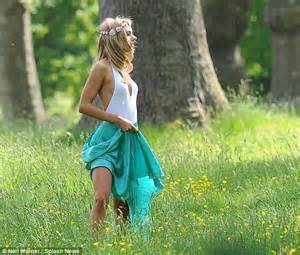Kimberley Garner Poses In Plunging White Lycra Top And Floaty Skirt For