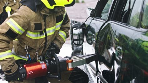 Firefighter Uses Jaws Of Life To Extricate Trapped Victim From The Car
