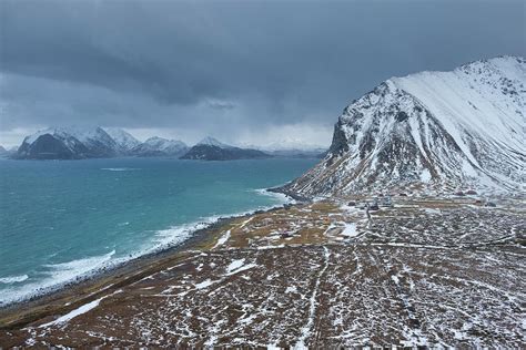Winter View Over Coastal Village Of Myrland And Surrounding Mountain