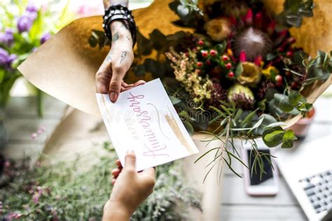 Florist Making Fresh Flowers Bouquet Arrangement With Happy Anniversary