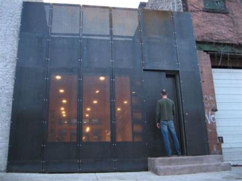 Facade In Black Glass Juxtaposition Of Old Brick