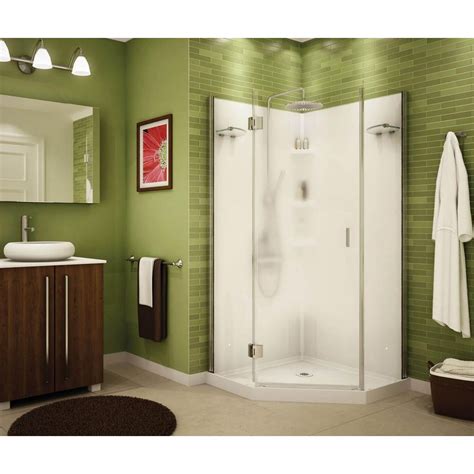 A Bathroom That Has Green Walls And White Fixtures On The Wall Along