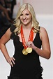 British swimming gold medallist Rebecca Adlington holds her medals as ...