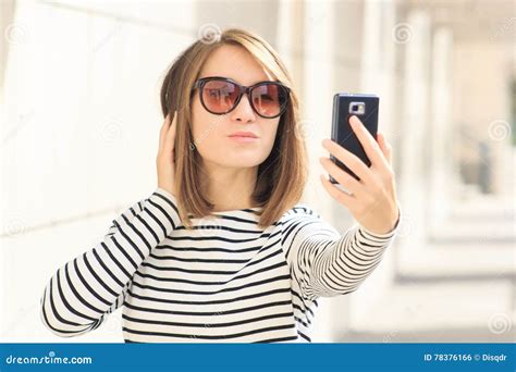 Young Woman Using Mobile Phone Taking Selfie Picture Self Portrait