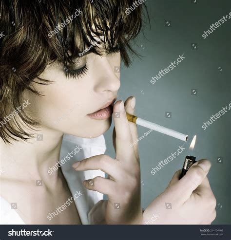 Beautiful Woman Smoking A Cigarette Stock Photo 214104466