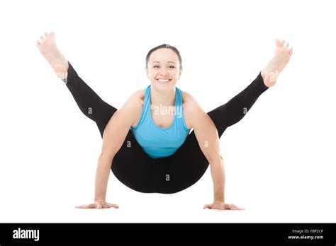Smiling Sporty Yogi Girl Doing Fitness Exercises Yoga Asana Tittibhasana Arm Balance Firefly